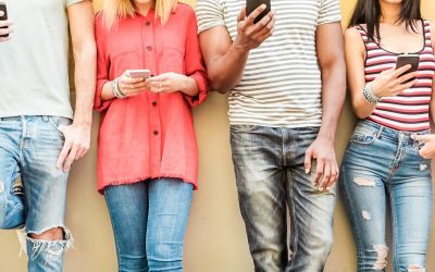 Group of teen friends watching smart mobile phones - Millennials generation addiction to new technology trends - Concept of youth, tech, social and friendship - Main focus on center hands